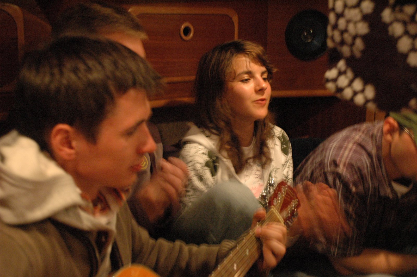 Marcin playing the guitar and Anna singing polish folk songs..