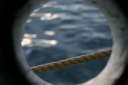 Ropes running across the hull of the ship