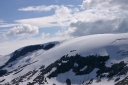 Pristine snow cap covers the mountain top